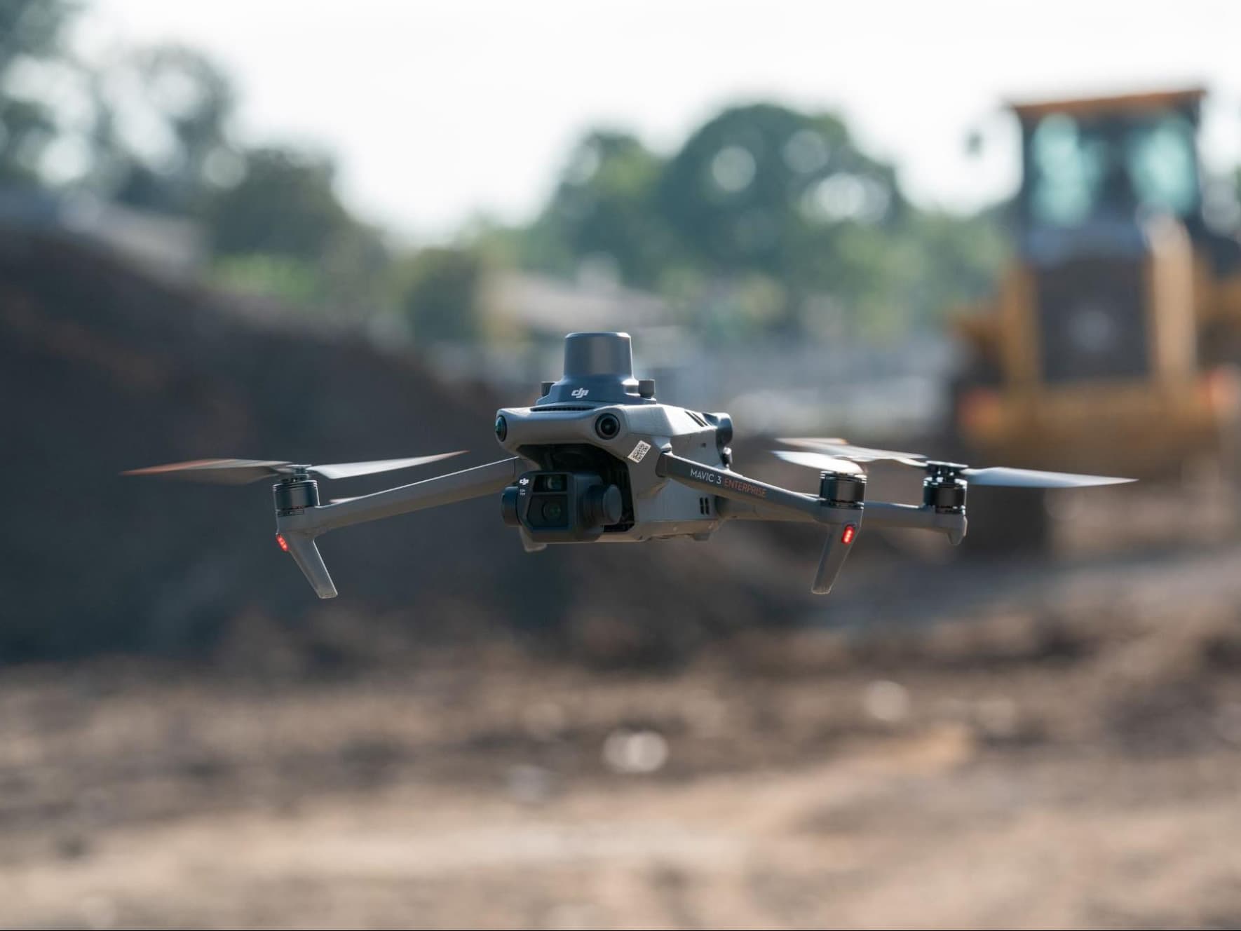 DJI Mavic 3 Enterprise RTK in flight at survey construction site